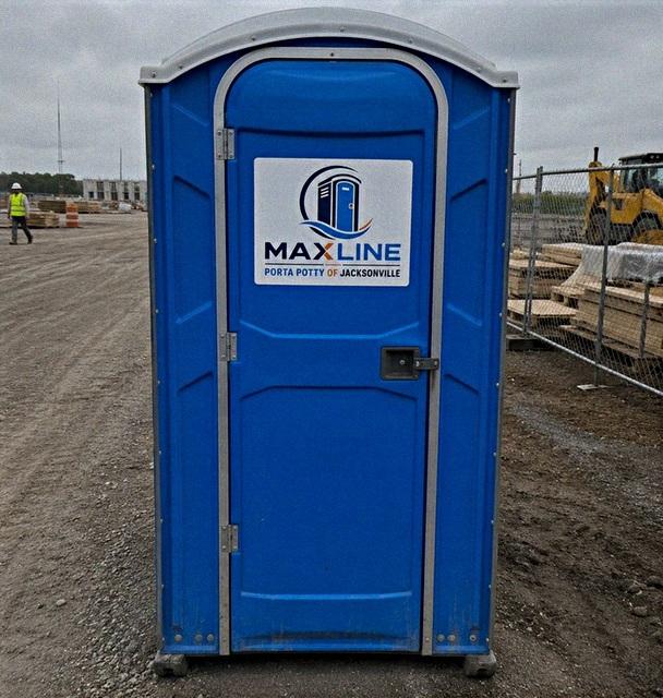 Maxline portable toilet set up on an active construction site