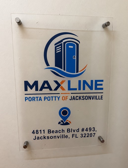 Acrylic Maxline Porta Potty of Jacksonville sign mounted at the office entrance